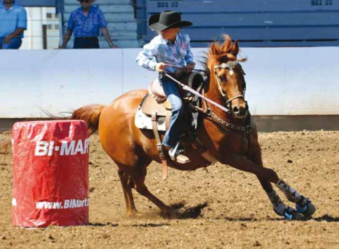 Joelle Mattox (9) barrel racing at the NW Youth Rodeo in St Paul, OR., © Ropin' The Moment Photography.