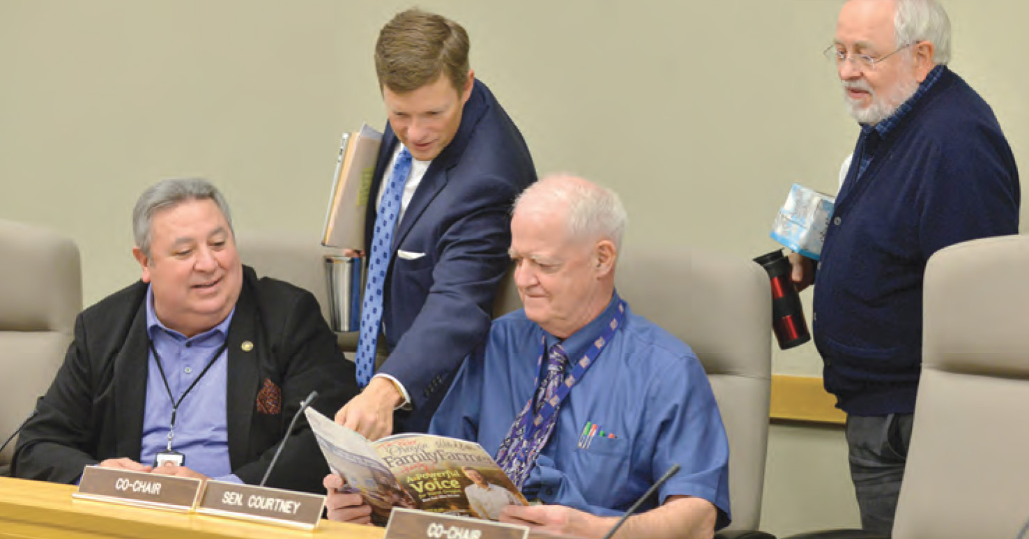 (Left to Right) Former Senate Minority Leader Ted Ferrioli, House Minority Leader Mike McLane, Senate President Peter Courtney, and House Revenue Chair Representative Phil Barnhart take a look at McLane’s cover article in the Fall 2017 issue.